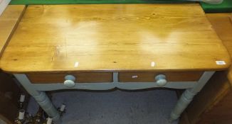 A pine topped two drawer side table with green painted base