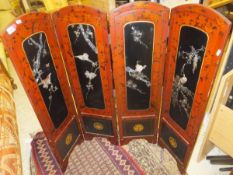 A Japanese lacquered four fold screen with mother of pearl inlay of peacocks and other birds