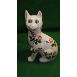 A Griselda Hill Wemyss pottery cat decorated with clover flowers and stems