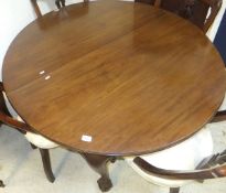 An Edwardian mahogany extending D end dining table with two extra leaves,