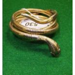 A 9 carat gold bracelet in the form of a coiled snake set with ruby eyes CONDITION REPORTS General