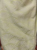 A pair of yellow and white woven patterned lined curtains with triple pleat headers