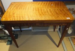 A 19th Century mahogany and inlaid foldover card table on square tapered legs