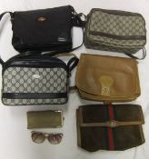 A bag containing assorted Gucci and other bags and a pair of sunglasses