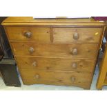 A pine chest of two short and three long drawers on bracket feet