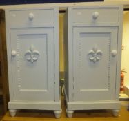 Two grey painted and marble top pot cupboards with fleur de lys applied mouldings to doors,