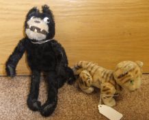 A vintage woodwool filled and wirework Felix The Cat toy, a woodwool filled tiger cub toy