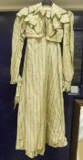 A 19th Century (circa 1820) cream dress with green striped decoration