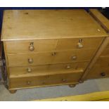 A Victorian pine chest of two short and three long drawers, with wooden handles,