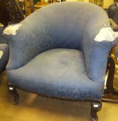 Two tub chairs in blue foliate patterned upholstery, together with an iron fire kerb,