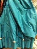 A pair of turquoise silk interlined curtains with goblet heading and cream silk button decoration