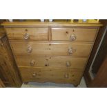 A Victorian pine chest of two short and three long graduated drawers,