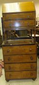 An oak chest of four drawers with turned wooden handles and turned bun feet,