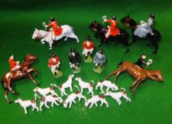 A collection of 18 Britains Hunt figures including three huntsmen on horseback and two standing,