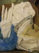 A box containing assorted mid 20th Century table linen