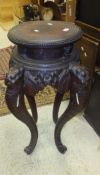 A circa 1900 Chinese carved hardwood jardiniere stand,