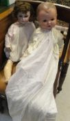 A Kammer & Reinhardt bisque headed doll with sleep eyes and open mouth and a jointed composition