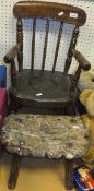 A 19th Century child's beech and elm stick back commode chair,