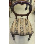 A set of five Victorian mahogany balloon back dining chairs with serpentine fronts and turned and