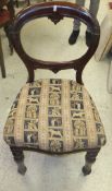 A set of five Victorian mahogany balloon back dining chairs with serpentine fronts and turned and