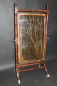 A 19th Century mahogany rectangular cheval mirror on turned frame with acorn finials and