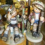 A collection of four Goebel Hummel figures to include "Boy sitting upon mountain top in Tyrolean
