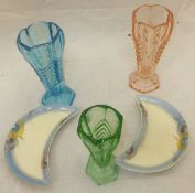 A collection of four Clarice Cliff crescent shaped dishes, together with a collection of coloured