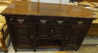 A Victorian mahogany dresser base with two short and one long drawer above cupboard doors  and an