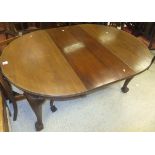 An Edwardian D end extending dining table on cabriole legs to claw and ball feet,