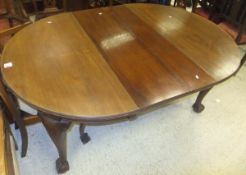 An Edwardian D end extending dining table on cabriole legs to claw and ball feet,