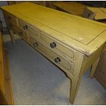 A 19th Century painted pine bank of five drawers on square tapered legs