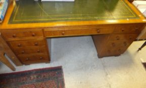 An early 20th Century oak partners desk