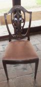 A set of eight early 20th Century Hepplewhite style mahogany framed dining chairs with shield