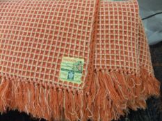 Two Welsh waffle pattern blankets bearing label inscribed "Brynkir Made in Wales from pure new wool