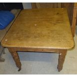 A Victorian pine extending dining table, with extra leaf,