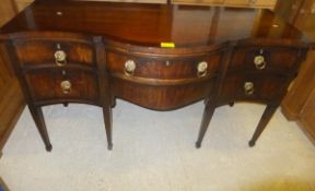 A Regency mahogany serpentine fronted sideboard with various drawers,