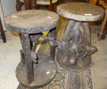 Two carved African hardwood stands, one formed as a figure holding table top aloft,