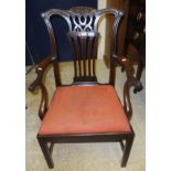 A 19th Century mahogany elbow chair with drop-in seat