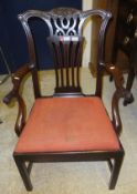 A 19th Century mahogany elbow chair with drop-in seat