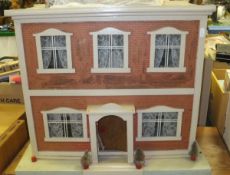 A painted and papered doll's house as a Georgian town house,