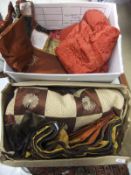 A box containing a collection of ethnic bed throws / wallhangings,