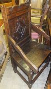 An oak Wainscott style dining carver chair with carved panel back in the form of a diamond and two