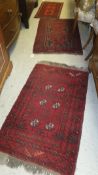 Three Bokhara rugs in red, black and cream 70 cm x 113 cm, 52 x 96 cm and 62 cm x 179 cm,