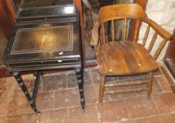 An Edwardian black painted Davenport type desk on turned and ringed legs and spindle stretchered