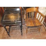 An Edwardian black painted Davenport type desk on turned and ringed legs and spindle stretchered