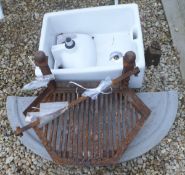 A Belfast sink, a smaller sink, a cast iron fire grate,