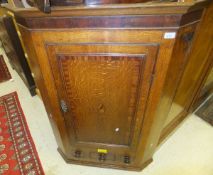 A 19th Century oak wall hanging corner cabinet,