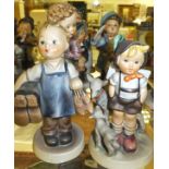 A collection of eight Goebel Hummel figures to include "Boots", "Little goat herder",
