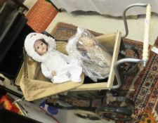 A vintage dolls pram, Palitoy doll,