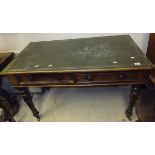 A Victorian mahogany two drawer desk with tooled green leather inset top on four turned legs
